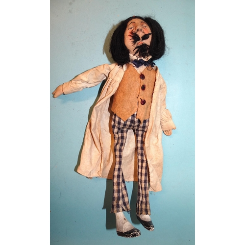 200 - An amusing man-doll with knitted painted face, supercilious sneer, wool moustache and beard and wool... 