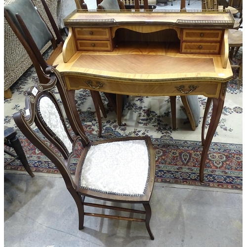 21 - A reproduction yew wood lady's dressing table, the top with metal gallery and four small side drawer... 