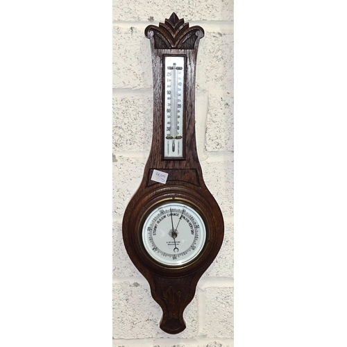 75 - A Schatz aneroid barometer, a Stockburger bulkhead clock, a reproduction ship's bell, all mounted on... 