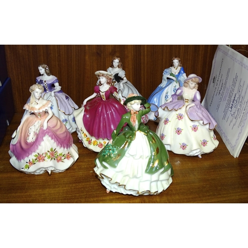 97 - A collection of seven Coalport 'Fairest Flowers' figurines: 'Holly', 'Violet', 'May', 'Poppy', 'Rose... 