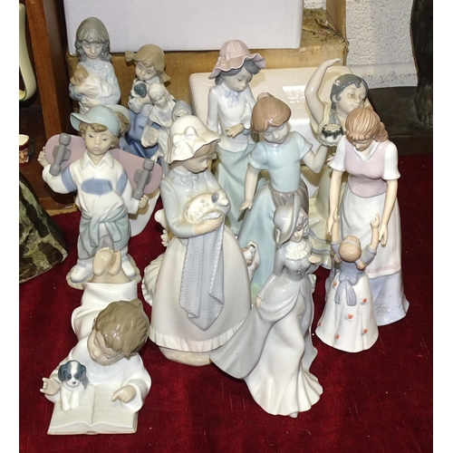 99 - A collection of seven Nao figurines, two Nadal figurines and eight others, (17).