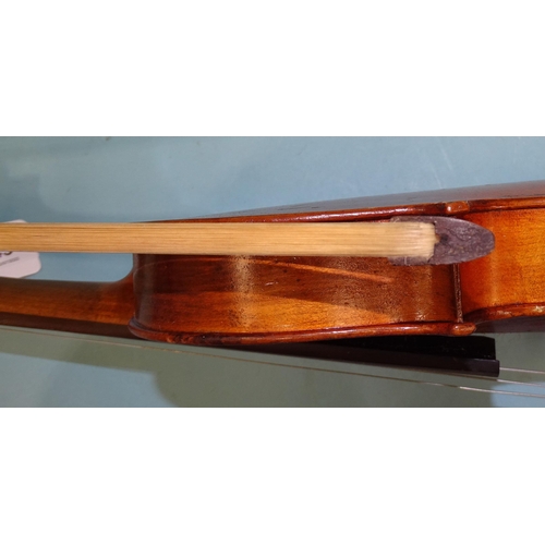 143 - A full-size violin (a/f), with one-piece back and bow, (no case).