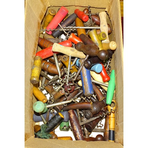 199 - A large collection of wood-handled corkscrews.