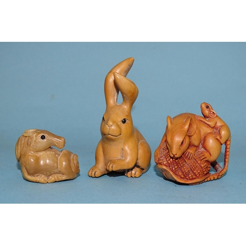 158 - A collection of three modern Japanese netsukes, a rat with young rat and a hare carved in wood and a... 