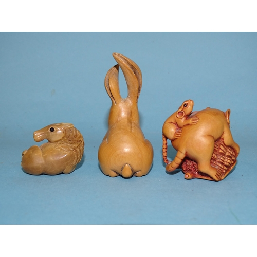 158 - A collection of three modern Japanese netsukes, a rat with young rat and a hare carved in wood and a... 