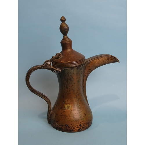 171 - A Middle Eastern copper coffee pot, 33cm high, (purchased in Yemen).