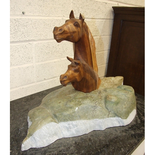 72 - Bridget Dumper MA (Sculpture) SWA, a carved wood sculpture of two horses' heads on naturalistic ston... 