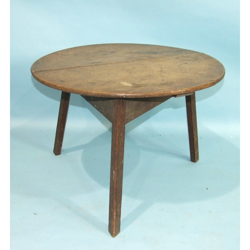 88 - A 19th century oak circular cricket table on chamfered legs, 68cm diameter.