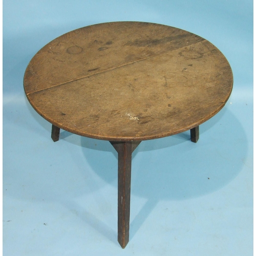 88 - A 19th century oak circular cricket table on chamfered legs, 68cm diameter.