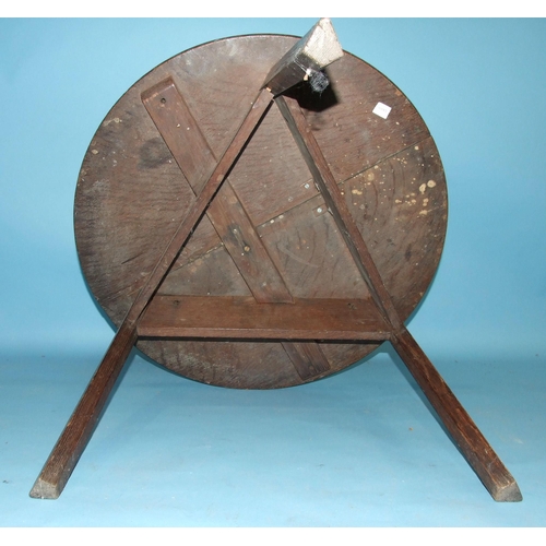 88 - A 19th century oak circular cricket table on chamfered legs, 68cm diameter.