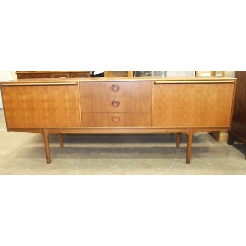 92 - A 1960's teak sideboard, possibly McIntosh 'Dunoon', the rectangular top above three central drawers... 