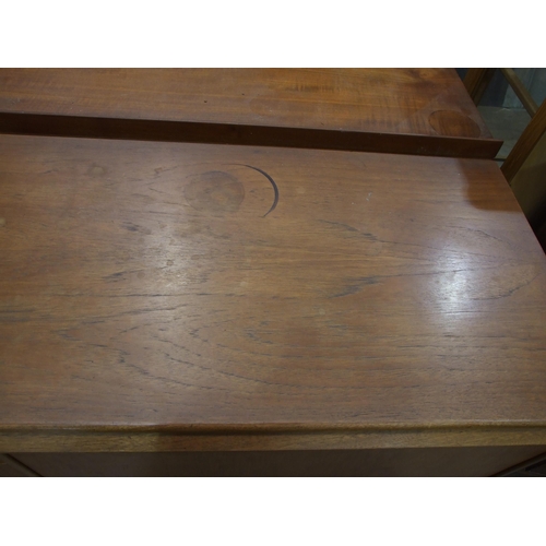 92 - A 1960's teak sideboard, possibly McIntosh 'Dunoon', the rectangular top above three central drawers... 