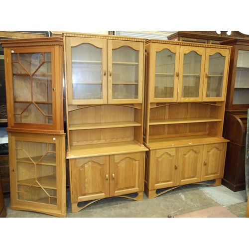 94 - A suite of modern amateur craftsman-built oak furniture, comprising two dressers with glazed and pan... 