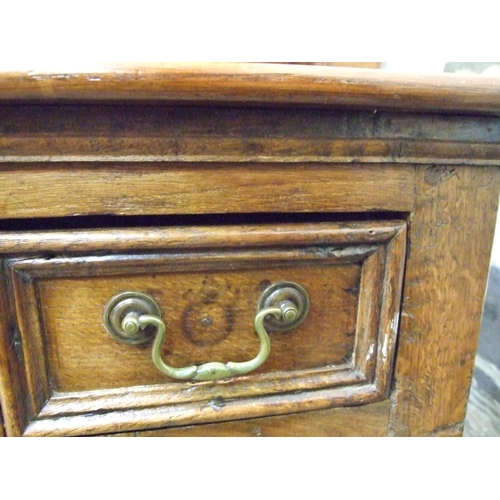 99 - A Georgian oak dresser, the plate rack fitted with two small cupboards above three drawers and two p... 