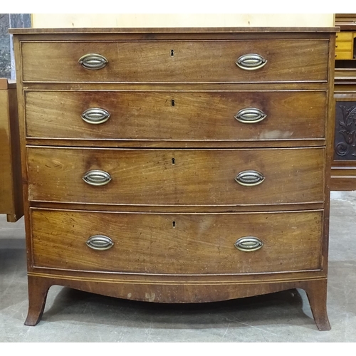 82 - A 19th century bow-fronted chest of four cockbeaded drawers, on splayed bracket feet, 99cm wide, 96c... 