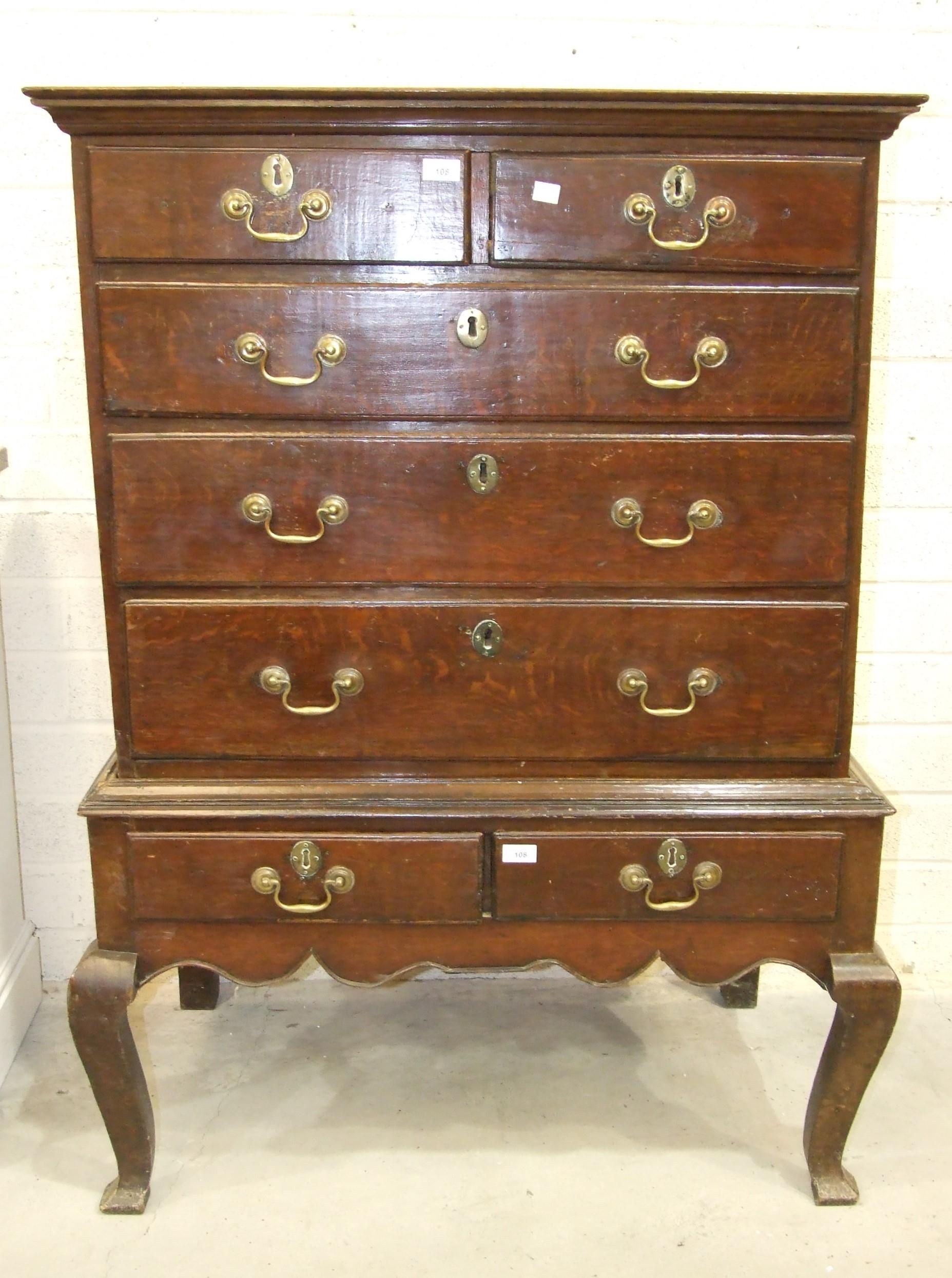 A Georgian oak chest on stand, the chest...