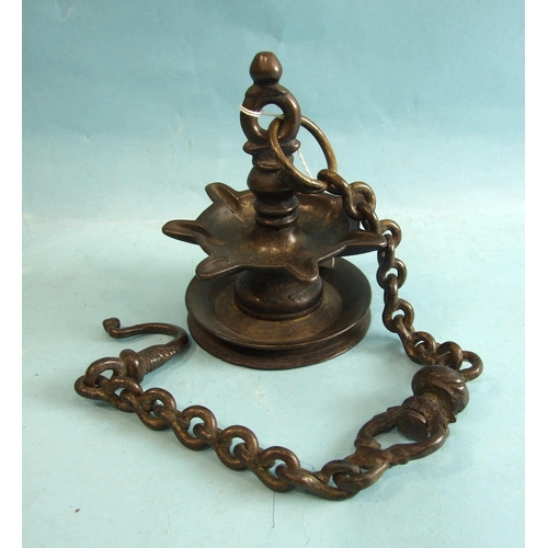 142 - An antique bronze hanging temple oil lamp, with seven wick wells, suspended from a chain, 15cm, 56cm... 