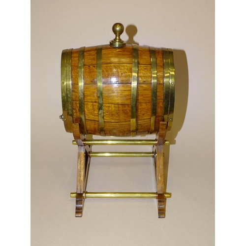 177 - An oak and brass coopered cask with glass end panels, inscribed Made from a piece of one of the... 