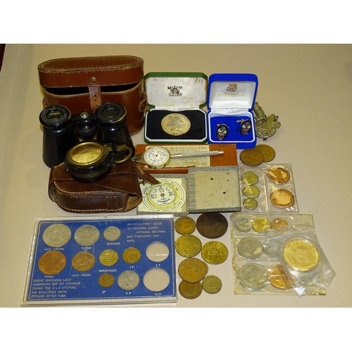 187 - A lacquered brass prismatic compass, 5cm diameter, (af), in leather case, a small quantity of coins ... 