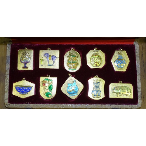 191 - A Peking Jewellery cased set of ten enamelled and gilded pendants, dated between 1966 and 1971, Chin... 