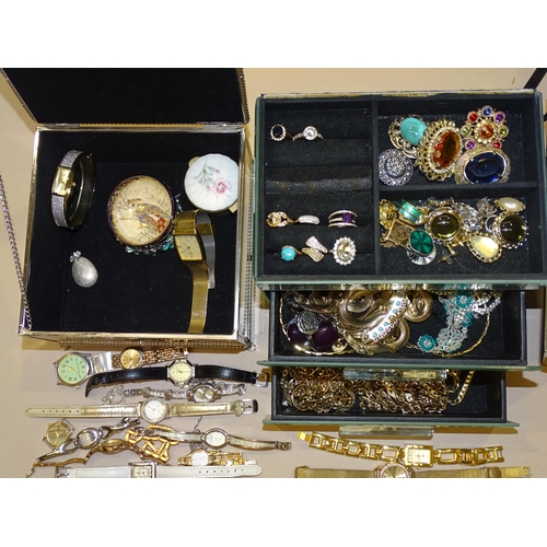 210 - A quantity of costume jewellery and wrist watches in two mirrored jewellery boxes.