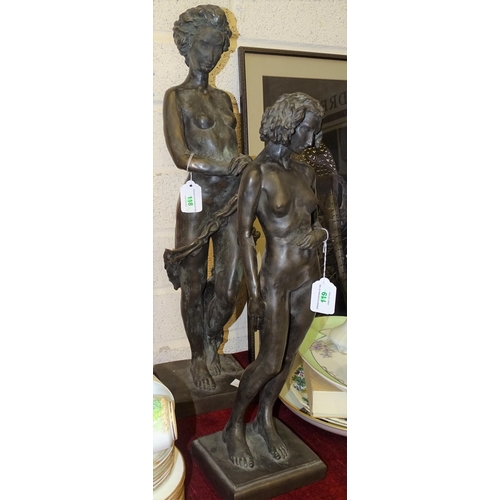 74 - R Moll, two contemporary bronzed cold-cast resin sculptures of standing naked female figures, 63cm a... 