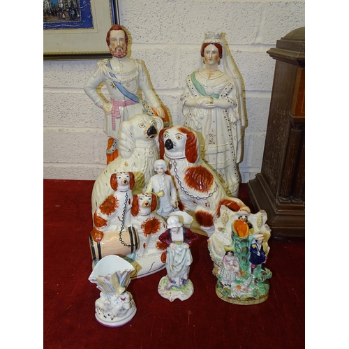 79 - A pair of 19th century Staffordshire figures, Queen of England and Prince of Wales, 43cm high, both ... 