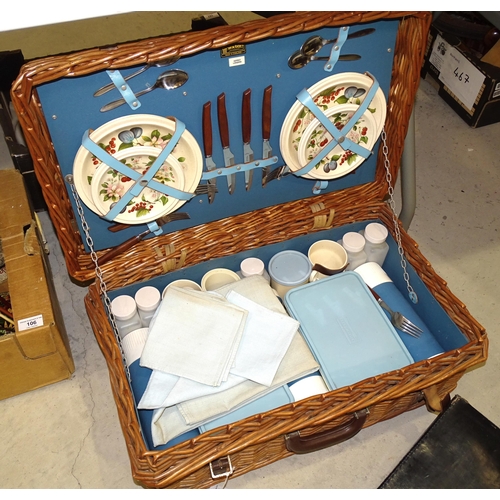 110 - A leather travelling drinks case and a Brexton wicker basket fitted with picnic items, Asprey London... 