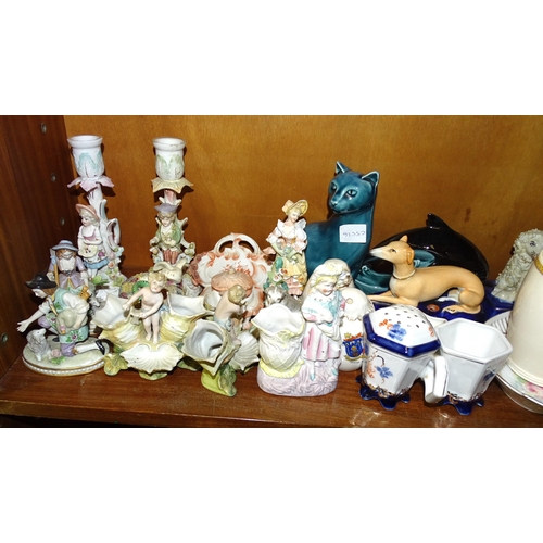 121 - A collection of Continental porcelain figures, a Poole Pottery blue-glazed cat and dolphin and other... 