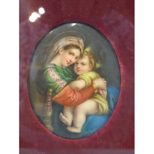 125 - A Continental oval ceramic plaque depicting the Madonna & Child, 8.2 x 6cm, framed.... 