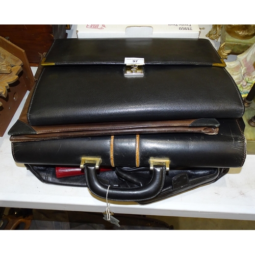 97 - A collection of leather document cases, wallets and other items.