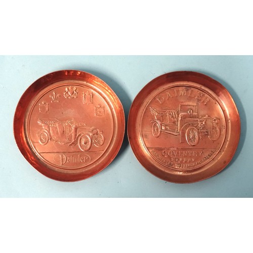 Two copper 'Daimler' advertising copper trays, 11.5cm diameter and a similar 'Pratts Perfection Spirit' tray, (3).