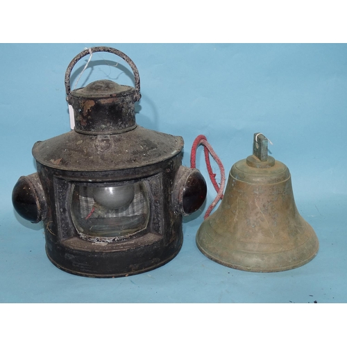 459 - A brass ship's bell, 18cm high, 17.5cm diameter and a black-painted metal 'bull's eye' hand lamp, 30... 