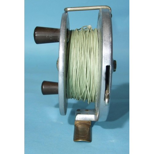 329 - A Hardy Bros Ltd alloy 4½'' trolling reel with brass foot, line guard, drag lever and Bakelite twin ... 