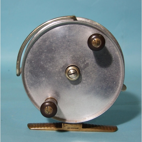 329 - A Hardy Bros Ltd alloy 4½'' trolling reel with brass foot, line guard, drag lever and Bakelite twin ... 