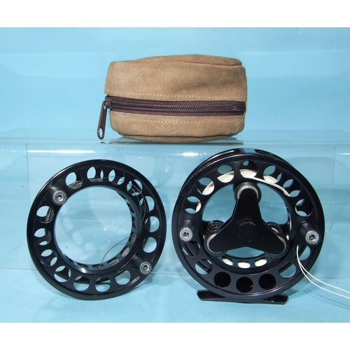 331 - A Sage Model 707 fly reel, finished black, with spare spool and pouch.