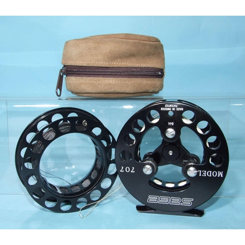 331 - A Sage Model 707 fly reel, finished black, with spare spool and pouch.