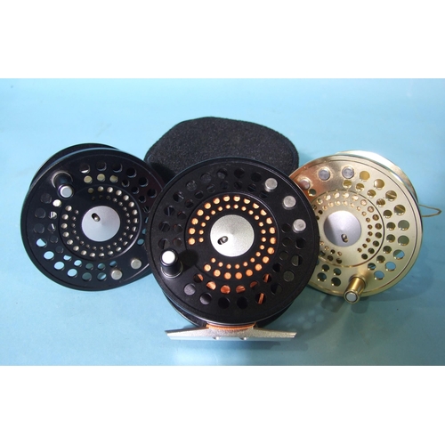 332 - A Marryat MR8.5 fly reel finished black, with two spare spools and pouch.