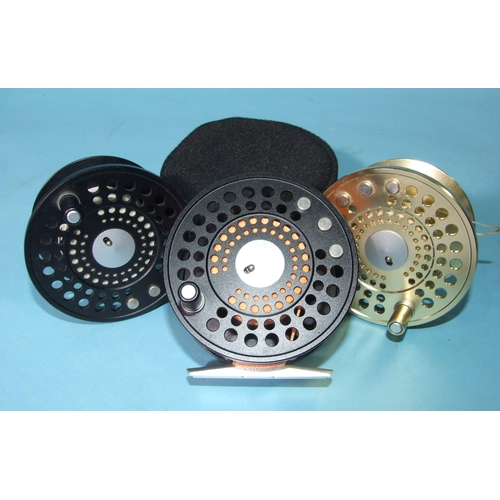 332 - A Marryat MR8.5 fly reel finished black, with two spare spools and pouch.