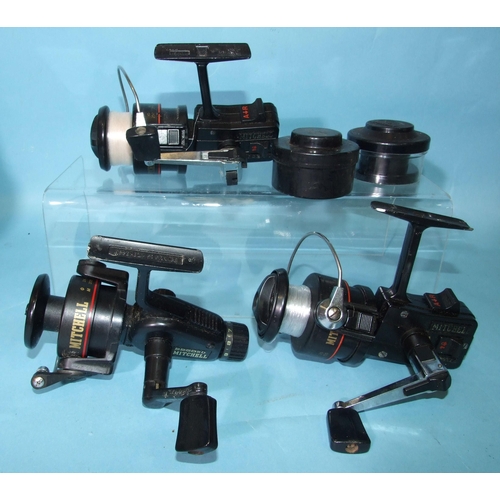 335 - An Abu Garcia Suveran spinning reel in box, with instruction manual, two Mitchell 44502 and a Mitche... 