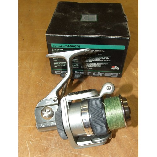 335 - An Abu Garcia Suveran spinning reel in box, with instruction manual, two Mitchell 44502 and a Mitche... 