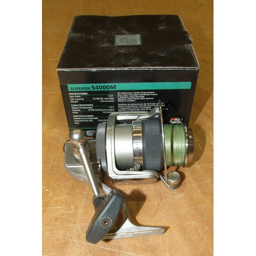 335 - An Abu Garcia Suveran spinning reel in box, with instruction manual, two Mitchell 44502 and a Mitche... 