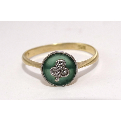 401 - An Edwardian ring set three 8/8-cut diamonds in shamrock or clover leaf design, on circular transluc... 