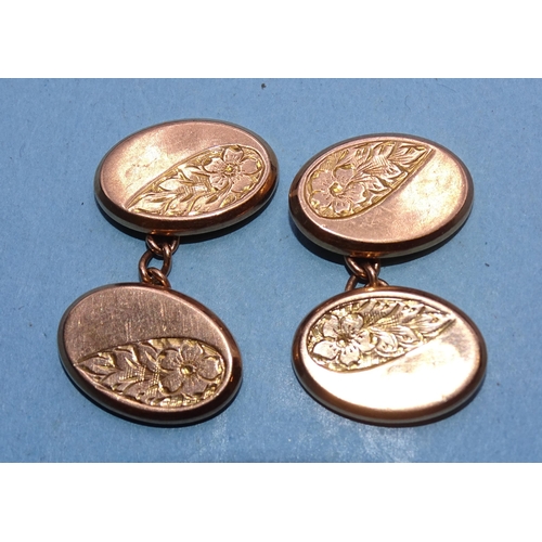 404 - A pair of 9ct rose gold cufflinks with engraved decoration, 3.8g.