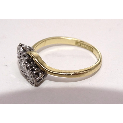 416 - A three-stone diamond ring, the brilliant-cut diamonds illusion-set in 18ct gold and platinum mount,... 