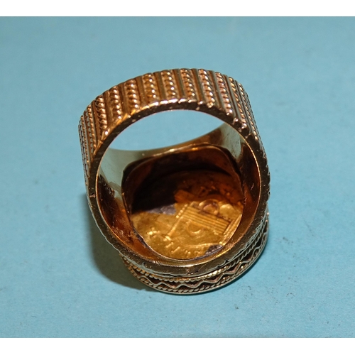 479 - A gentleman's 18ct gold ring inset a Greek gold coin, (solder visible on back), size O, 21.6g.... 