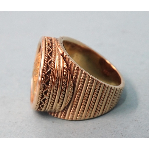 479 - A gentleman's 18ct gold ring inset a Greek gold coin, (solder visible on back), size O, 21.6g.... 