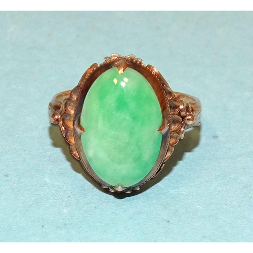 546 - A 14k gold ring set oval jade cabochon, size K½, 3.8g, (boxed).