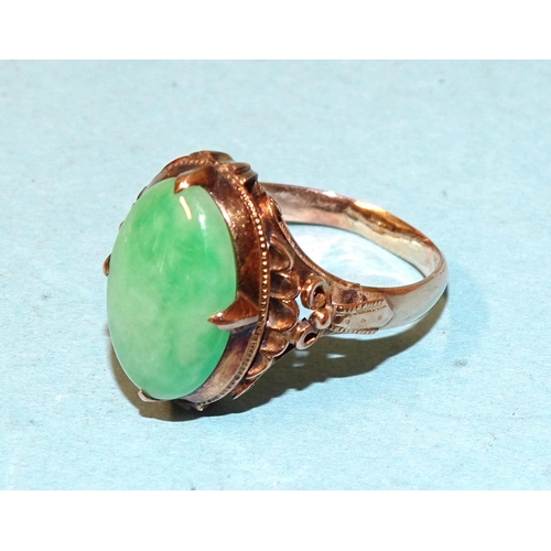 546 - A 14k gold ring set oval jade cabochon, size K½, 3.8g, (boxed).