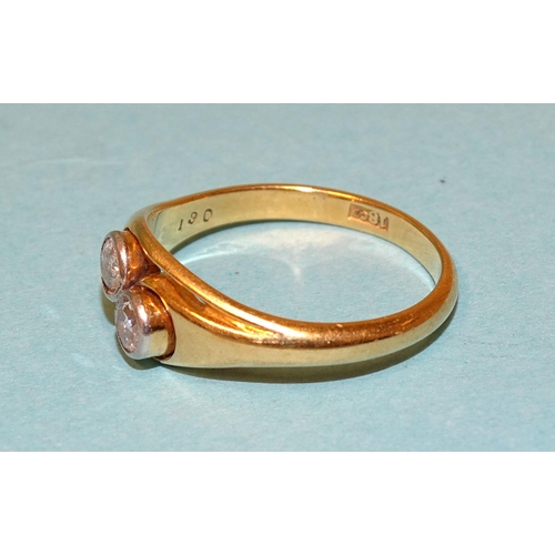 547 - An 18ct gold crossover ring set two old brilliant-cut diamonds, size M, 3g.